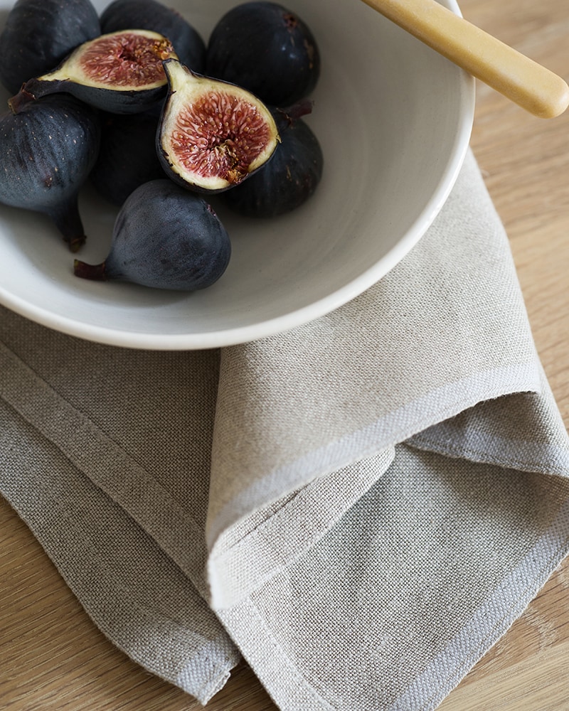 The pure linen flax selvedge serviettes are woven on the antique looms at the mungo mill in plettenberg bay South Africa, available in 16 colours and pictures here with a white stripe