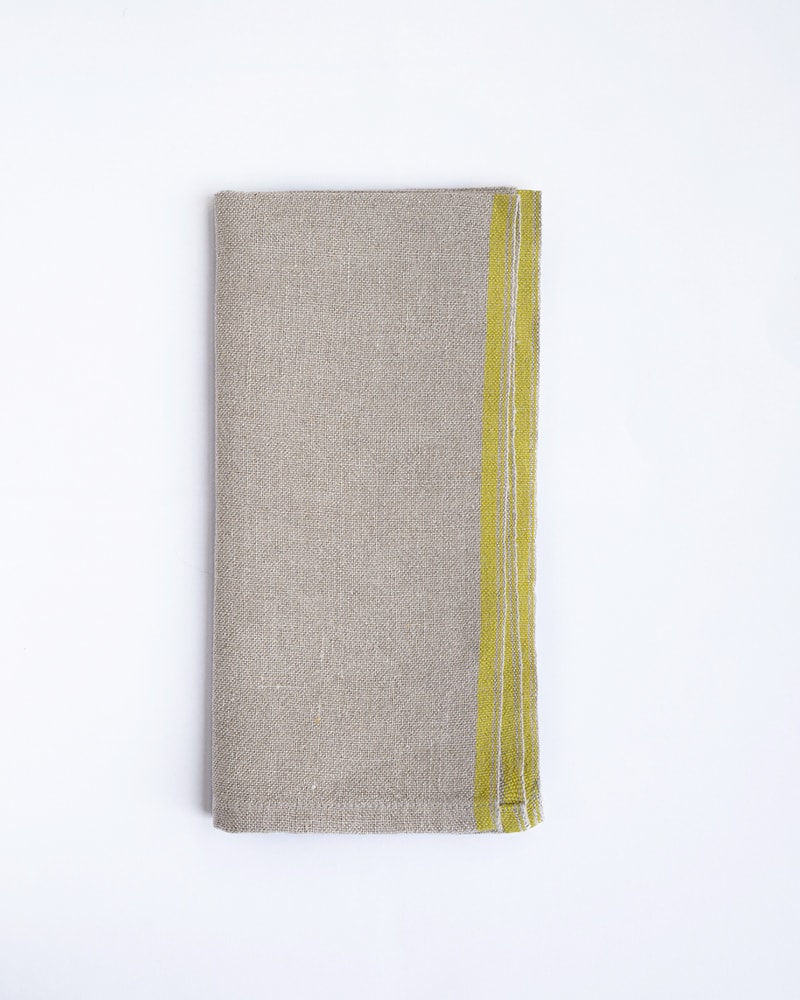 Flax Selvedge Napkins with a Citronelle stripe that runs along the true selvedge, woven at the Mungo Mill on antique Ruti looms