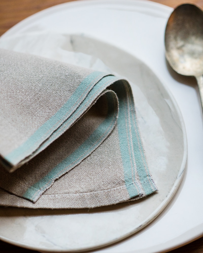 Flax Selvedge Napkins with a Duck Egg stripe that runs along the true selvedge, woven at the Mungo Mill on antique Ruti looms