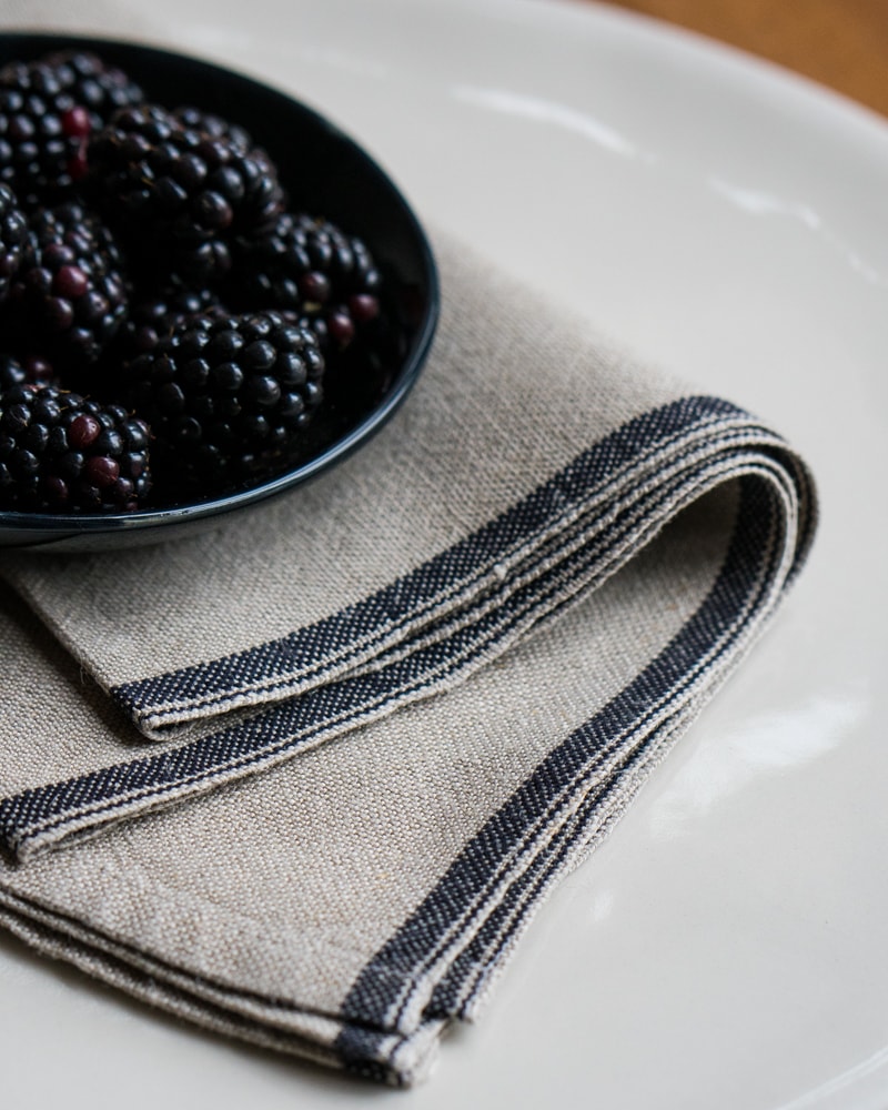 Flax Selvedge Napkins with a Black stripe that runs along the true selvedge, woven at the Mungo Mill on antique Ruti looms