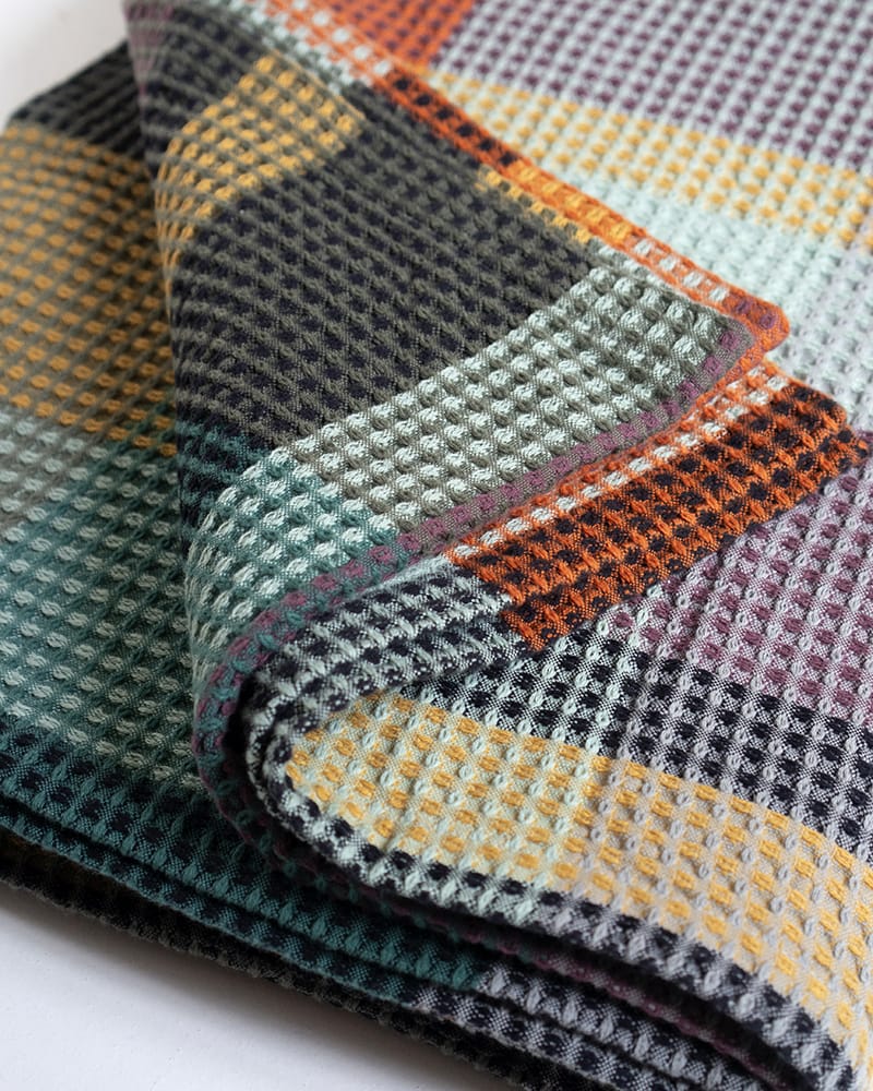Mungo Vrou Vrou Blanket in Cypress. Textural, multi-coloured waffle weave blanket woven at the Mungo Mill in Plettenberg Bay