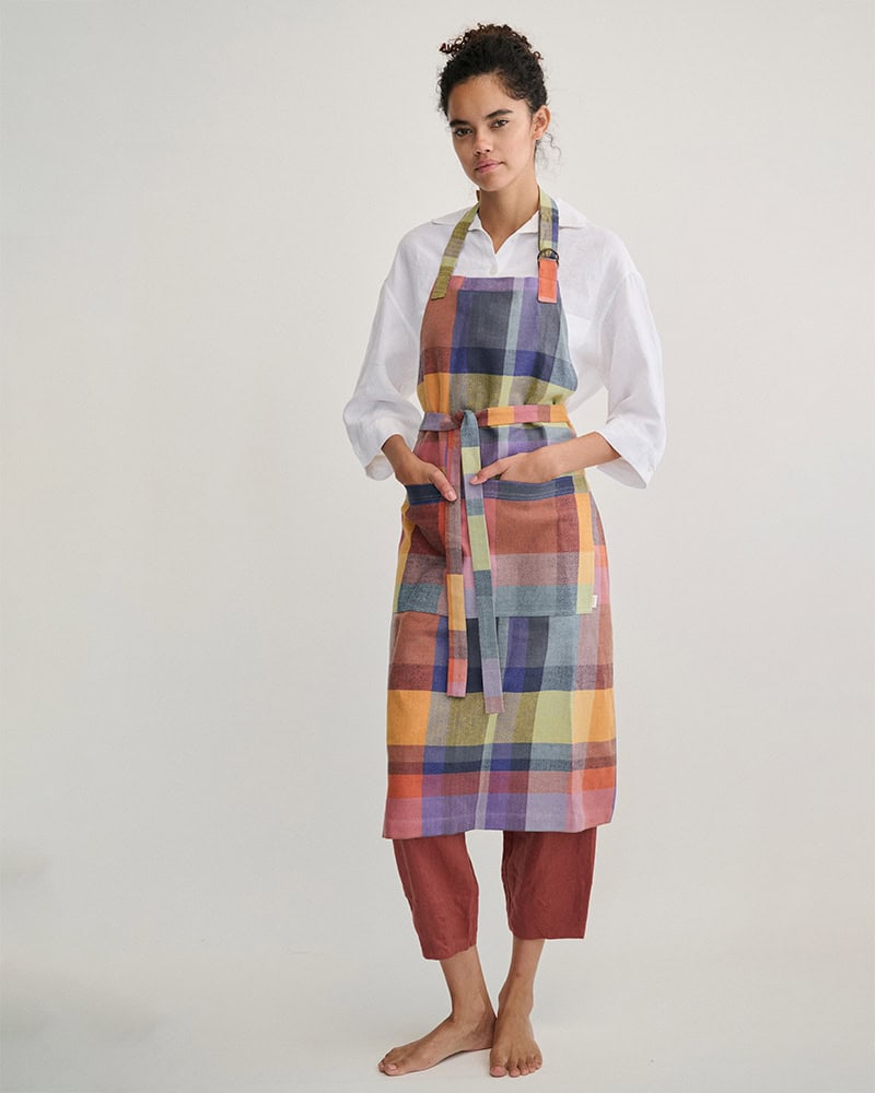 Model in Alles Apron in Iris full length