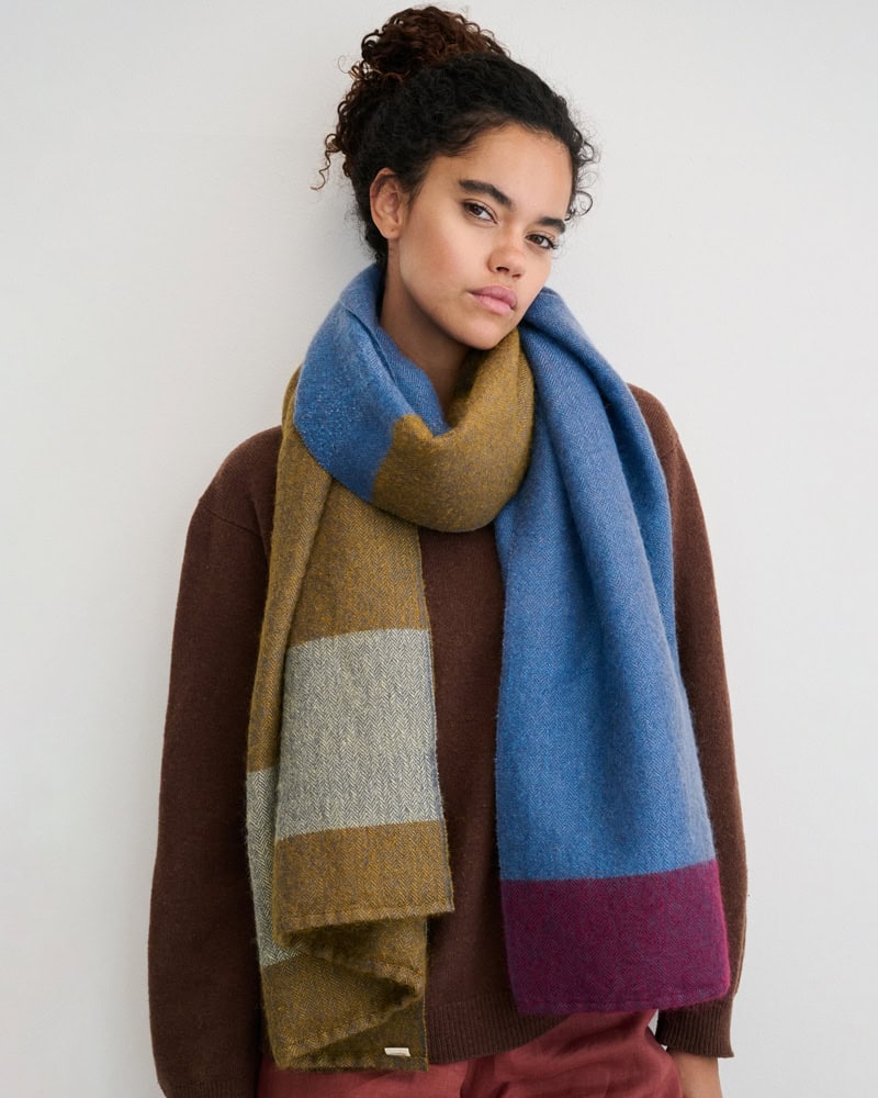 Model wearing Honeybee MOS Wrap, displaying its autumnal palette.