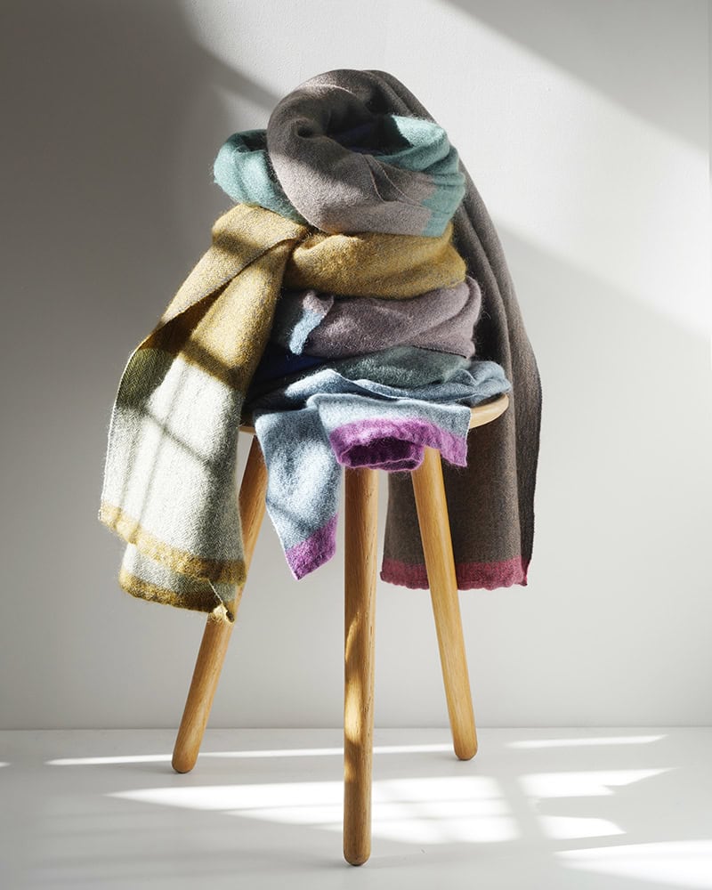 Multiple MOS wraps stacked on a stool.